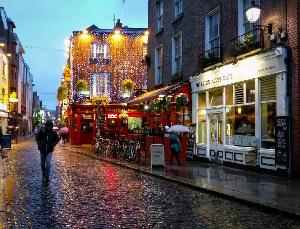 Ireland Dublin Temple Bar pub cobblestone street rainy evening