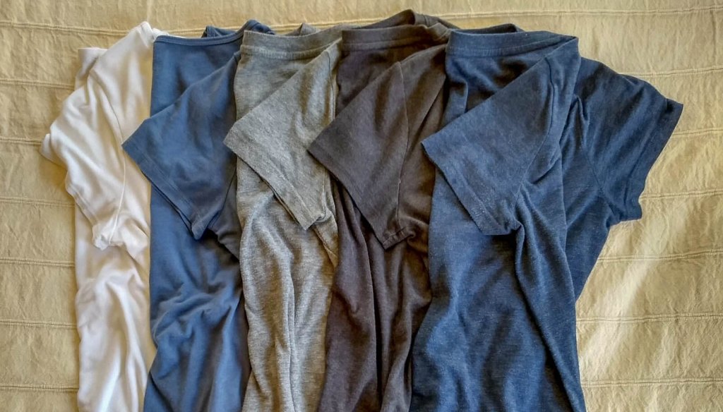 acking t-shirts in blue and gray for trip